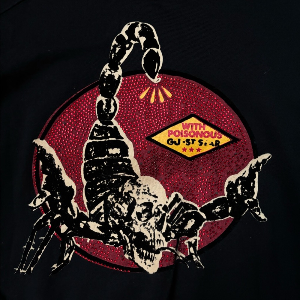 Black crewneck sweater with scorpion design